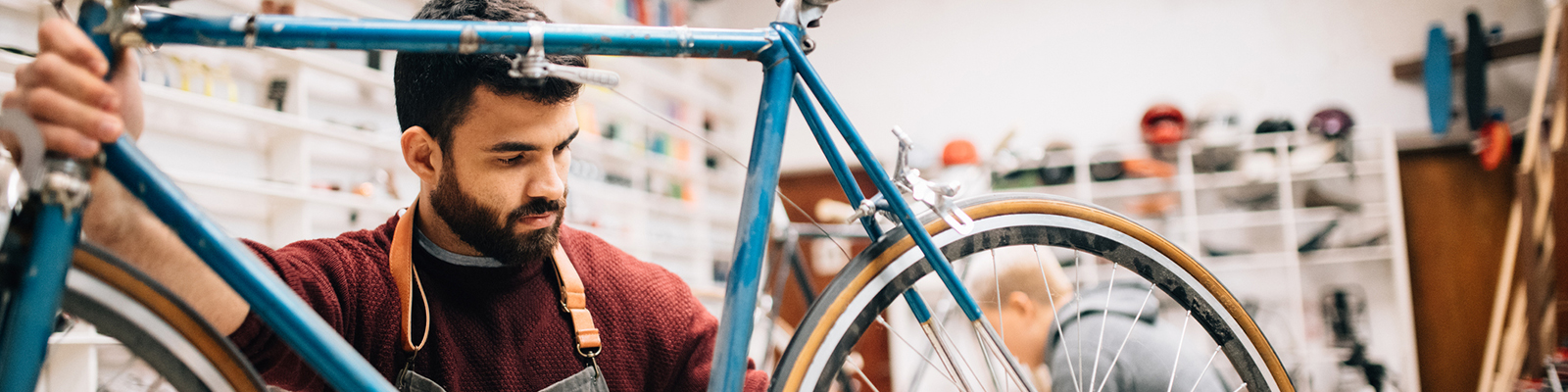 Business owner fixing bike