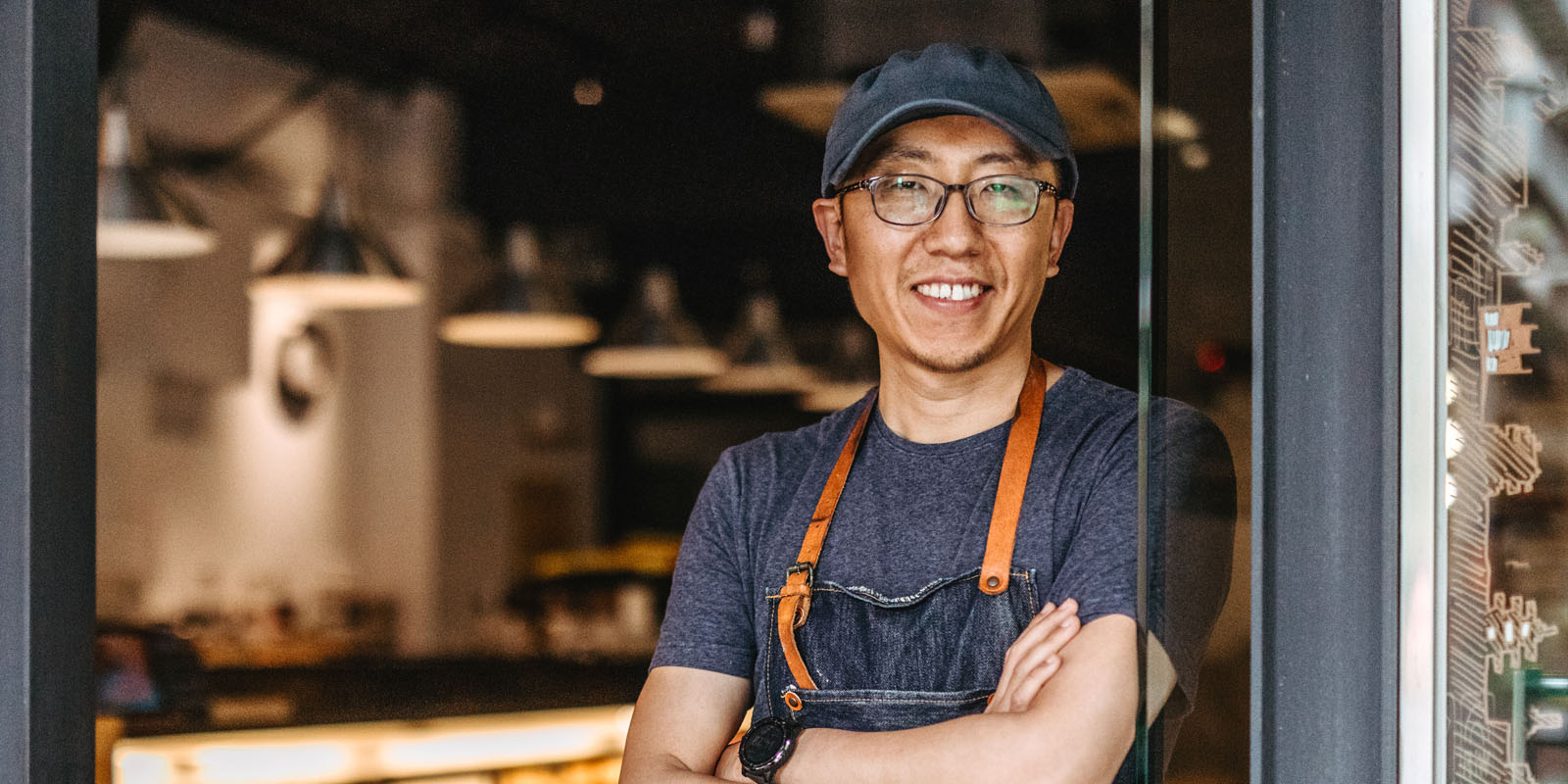 Man in apron in the doorway