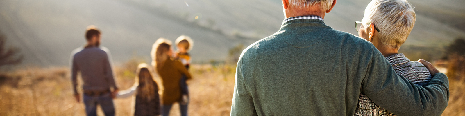 Parents admiring family in a field