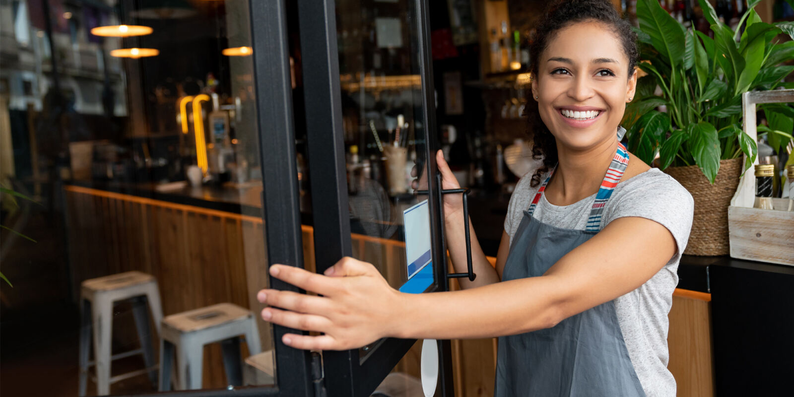 Business owner opening the door