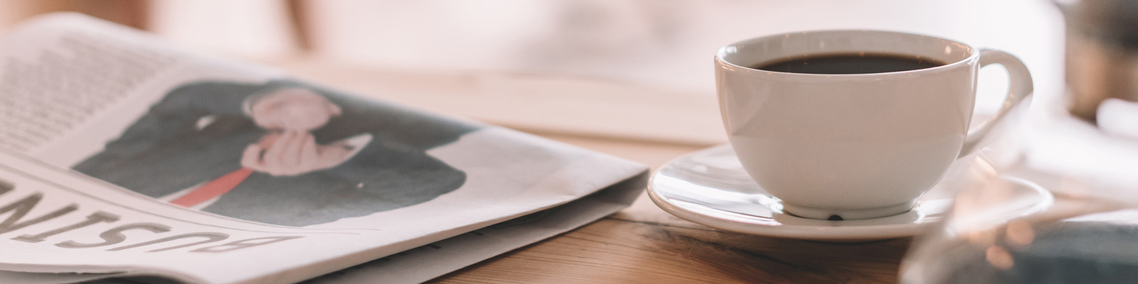 Newspaper and coffee cup