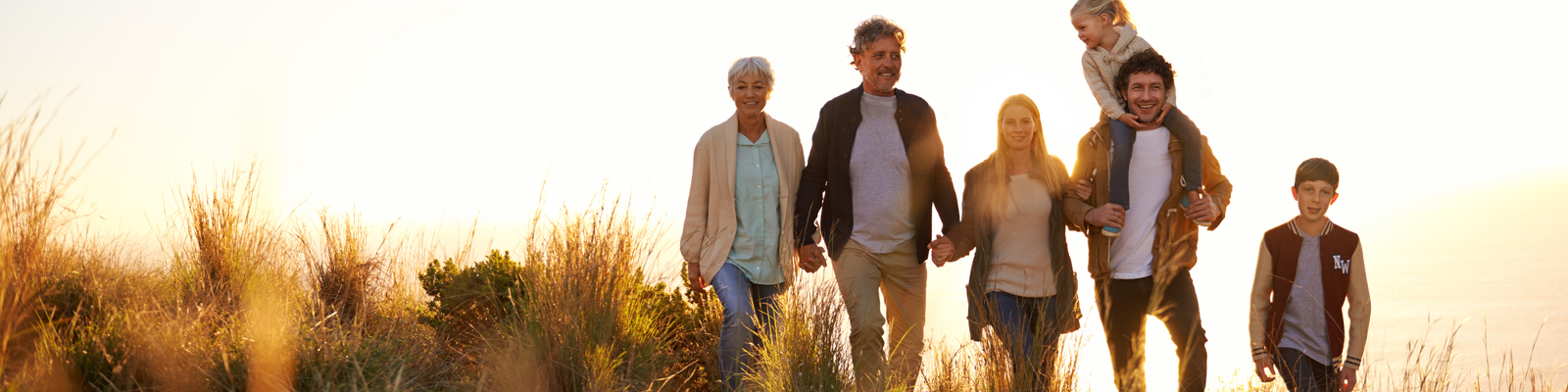 Family walking through pasture