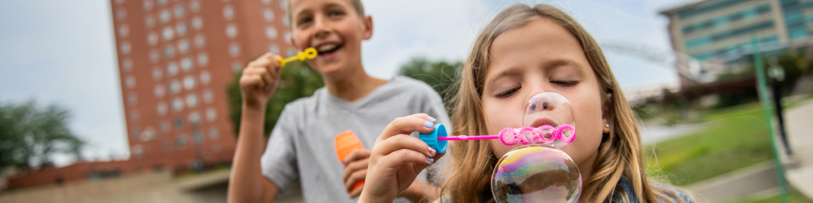 Kids blowing bubbles in Sioux Falls, SD