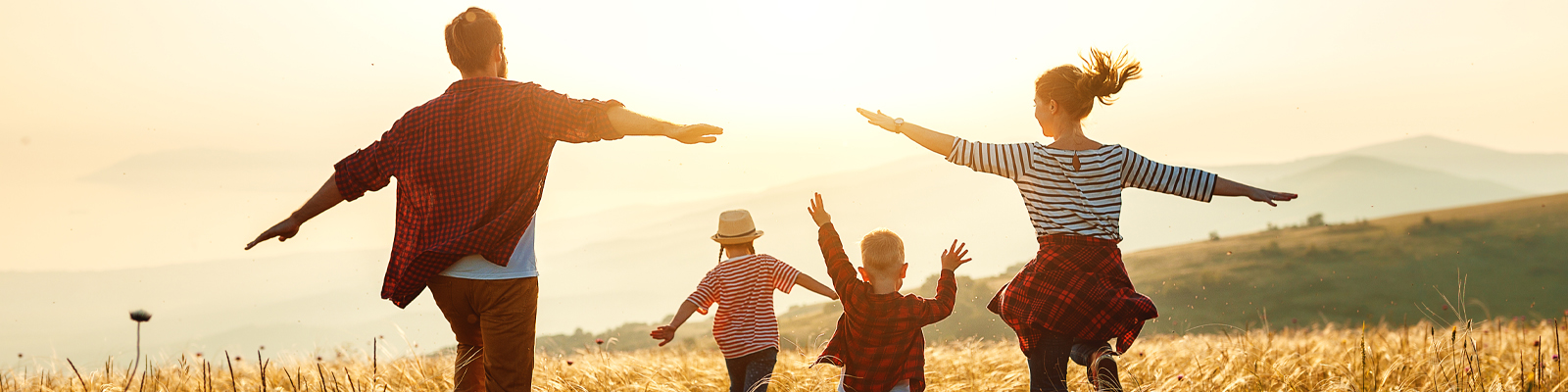 Family running through field