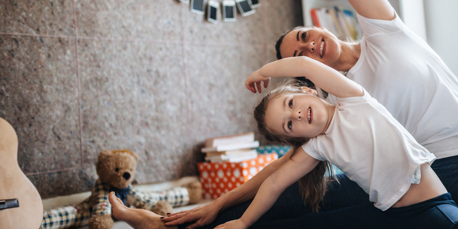 Mom and daughter stretching